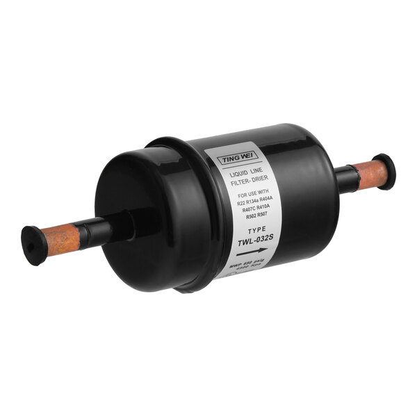 A black cylindrical liquid line filter drier with copper inlet and outlet connections, labeled for use in refrigeration systems.