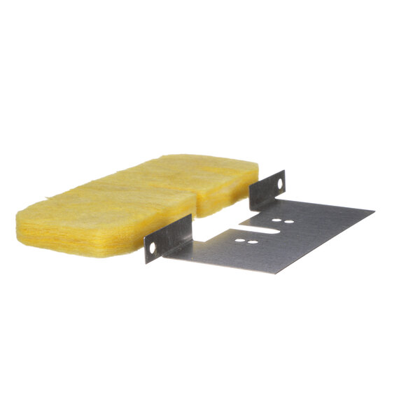 A yellow Hatco support plate with insulation on a metal surface.