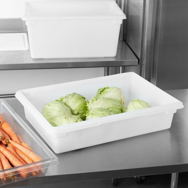 A white Rubbermaid food storage container full of carrots.