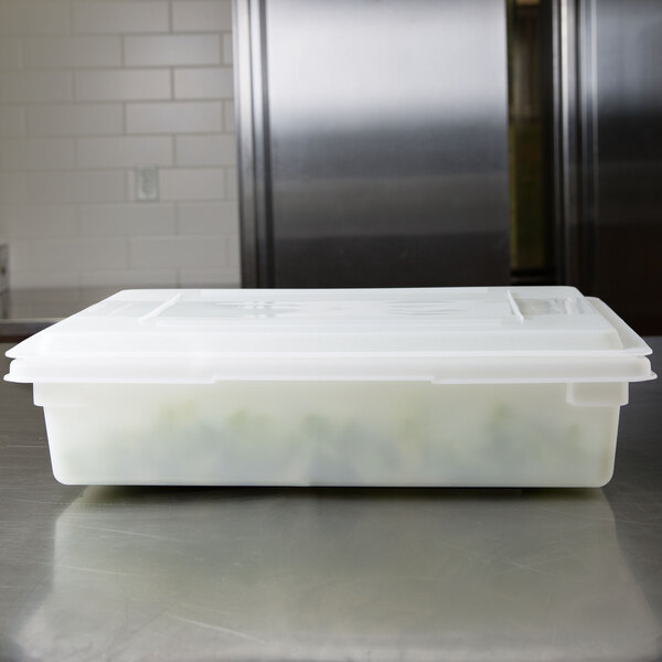 A white Rubbermaid polyethylene food storage box with a lid on a counter.