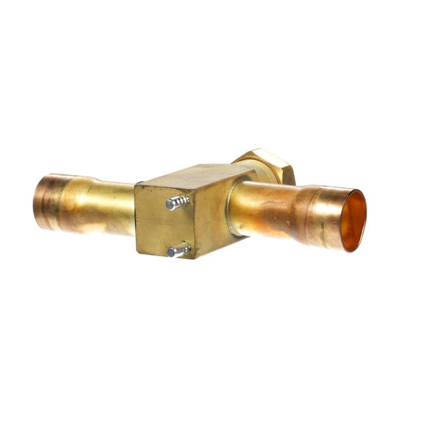 A gold metal Heatcraft valve with two pipes on it.