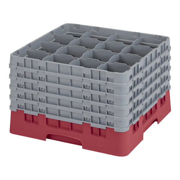 A red and gray plastic Cambro glass rack with 16 compartments and 5 extenders.