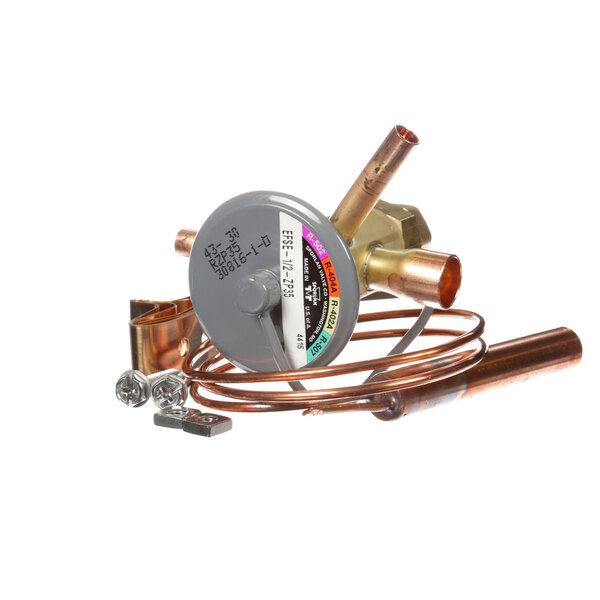 A close up of a Beverage-Air expansion valve on a copper pipe.
