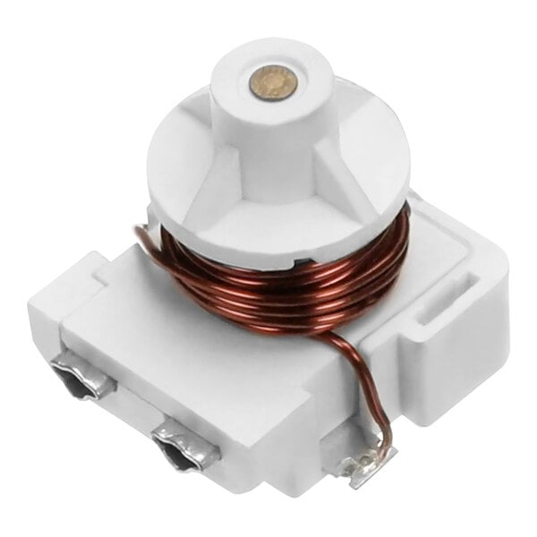 A white plastic device with a copper wire coil.