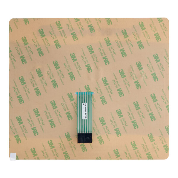 A square sheet with a 3M adhesive backing and a flat ribbon cable connector attached at the center.