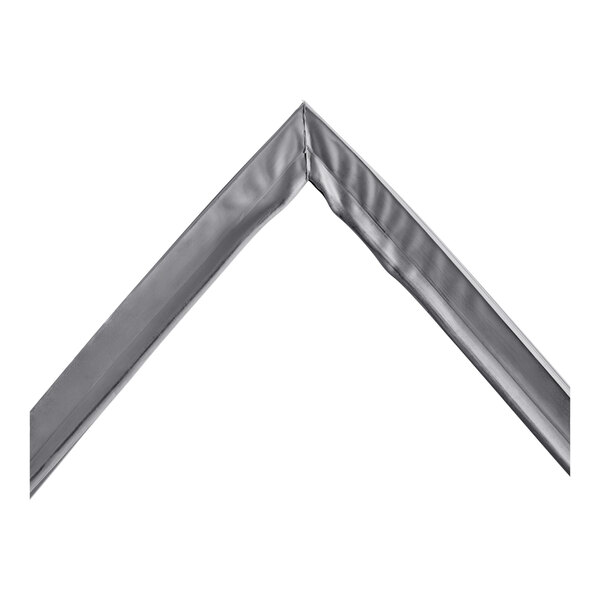 A close-up of a silver metal corner with a white background.