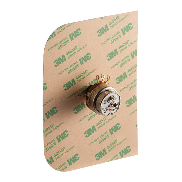 A close-up of a round metal Cleveland pot/switch.