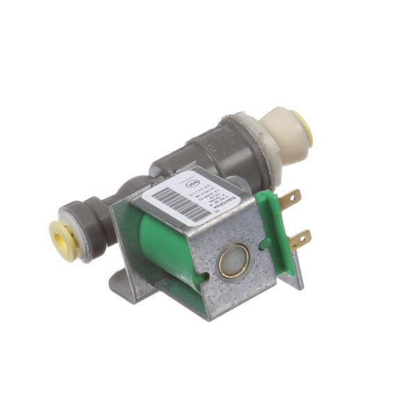 A close-up of a green and yellow Scotsman water valve.