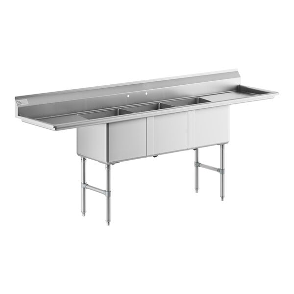 A stainless steel Advance Tabco commercial sink with three compartments and two drainboards.