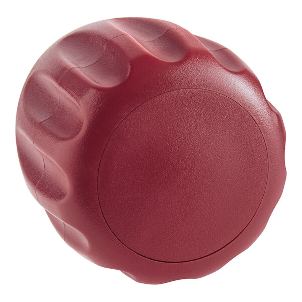 A red plastic round knob.