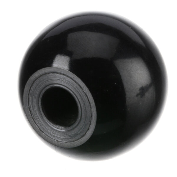 A black round ball with a hole in it.