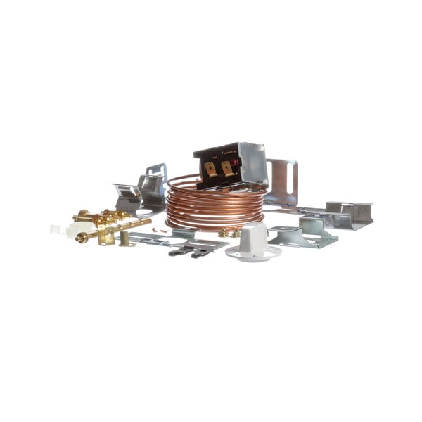 A Low Temp Industries thermostat with a variety of metal parts, including a copper pipe and a wire.