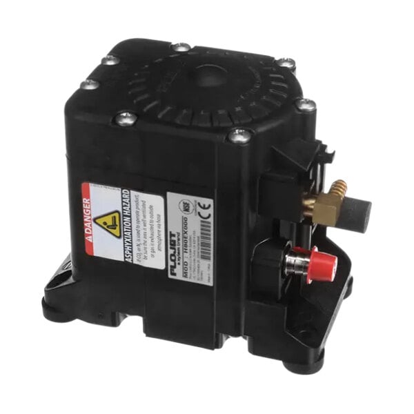 A black Flojet pump with a red valve in a black box with a white label.