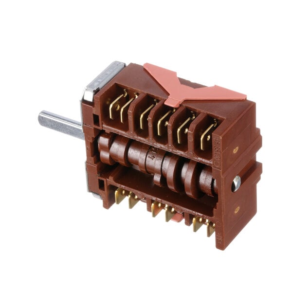 A close-up of a brown electrical switch with two wires and two pins.