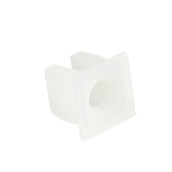 A close-up of a white plastic square grommet.