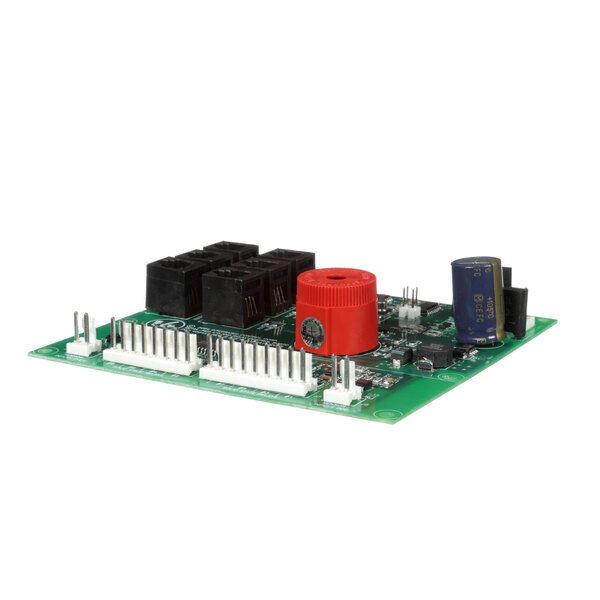 A green circuit board with a red circular object and black rectangles.