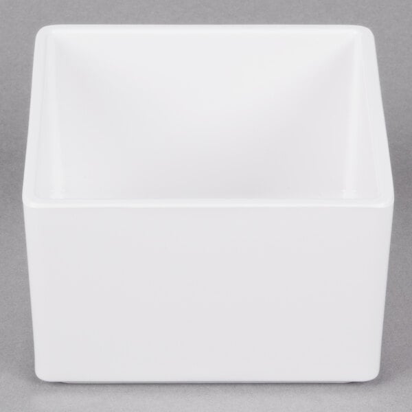 A white rectangular Cal-Mil melamine box with a black border.