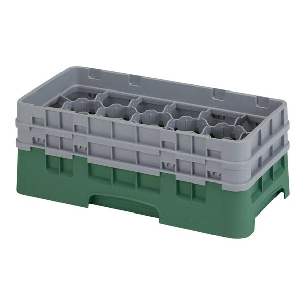 A grey and green plastic Cambro glass rack with 17 compartments.