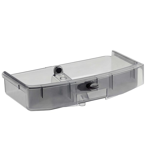 A clear plastic container with a black handle.