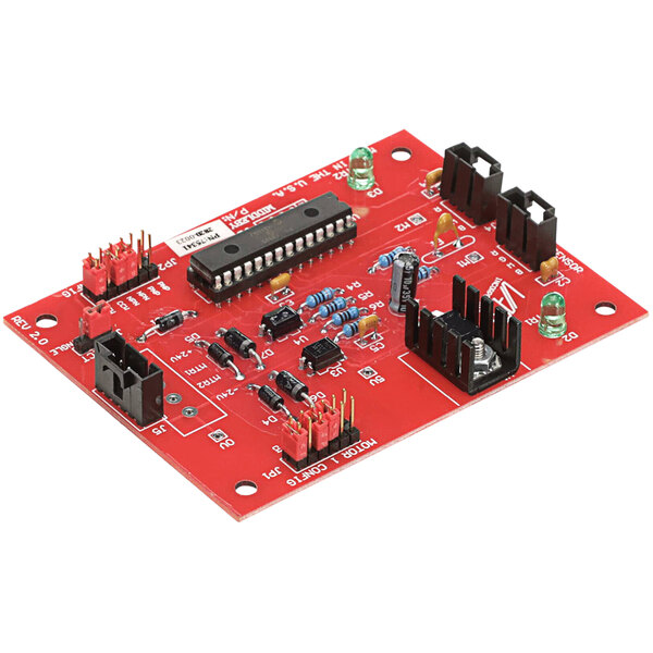 A close-up of a red circuit board with black and red components.