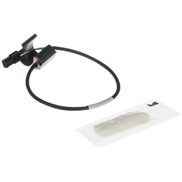 A black cable with a black wire and a white tag attached to it.