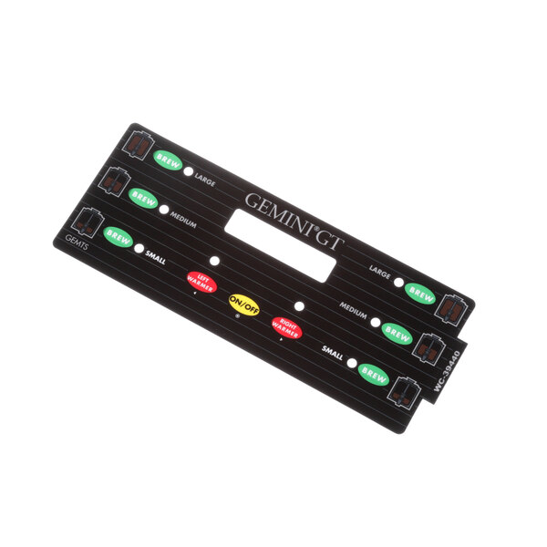 A black rectangular Wilbur Curtis control panel with different colored buttons.