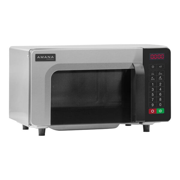 A stainless steel Amana commercial microwave with a black door.