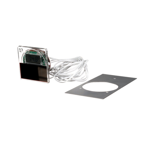 A Traulsen T-Meter Retrofit Kit, a small electronic device with a wire and a metal circle with holes.