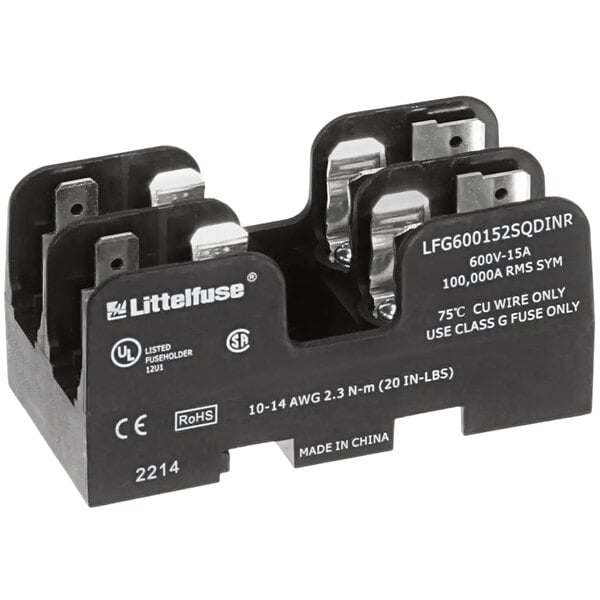 A close-up of a black and white APW Wyott fuse holder with silver metal terminals.