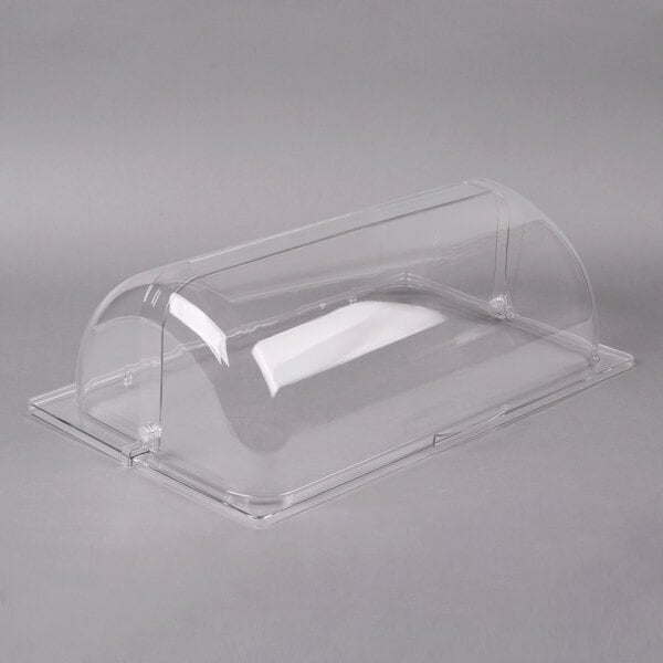 A clear plastic container with a clear cover on a counter in a bakery display.