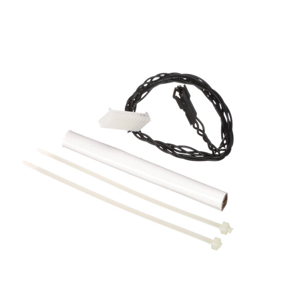 A white tube with black and white wires and white plastic pieces.