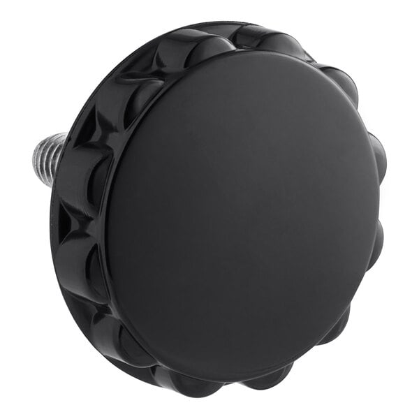 A black Hobart knob with a hole in the center and a screw.