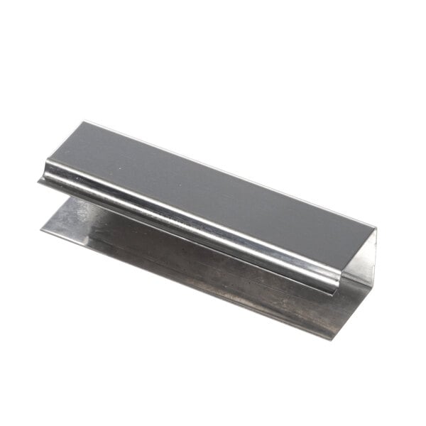 A silver metal hinge cover with a small hole in it.