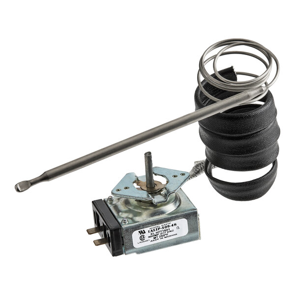 A metal thermostat component with a long probe, coiled sensor tube, and electrical connectors.