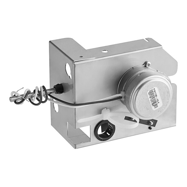 An Ice-O-Matic harvest kit metal box with a wire and round metal object inside.
