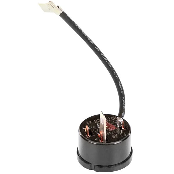 A black round Cornelius 18370 Overload with a wire attached.