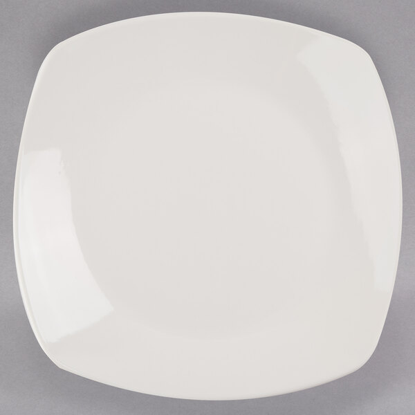 A Libbey ivory porcelain coupe plate with a small rim.