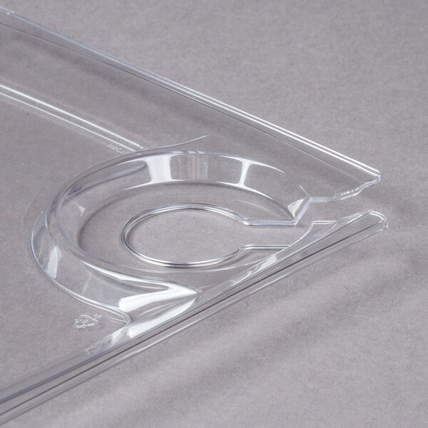 A clear square plastic tray with a curved edge and a circular cup holder.