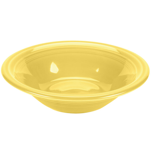 A yellow Fiesta china cereal bowl with a white background.