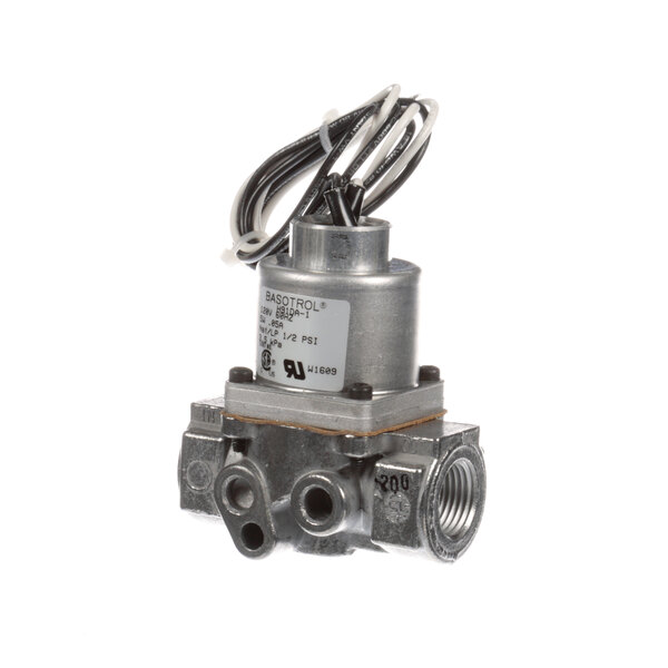 A Henny Penny gas solenoid valve with black and white wires.