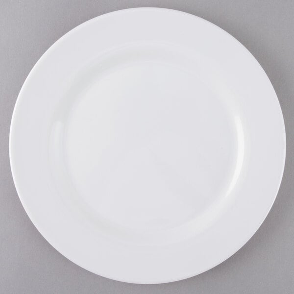 An Arcoroc Zenix white banquet plate with a white rim.