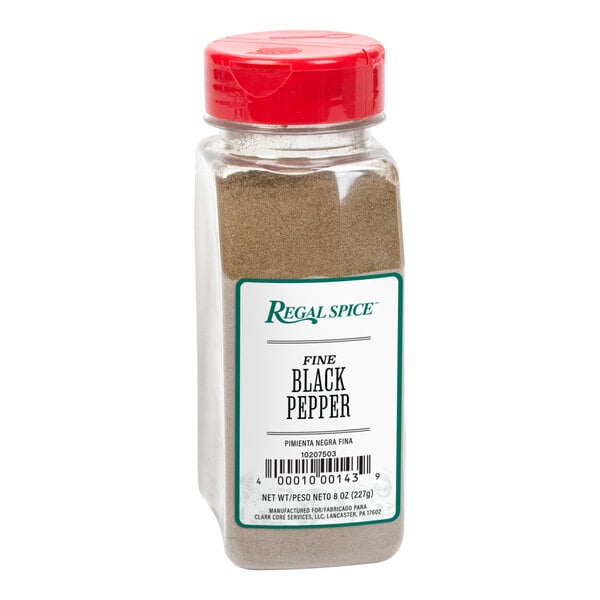 A bottle of Regal Fine Grind Ground Black Pepper on a white background.