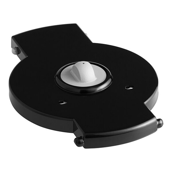 A white device with a black and white knob.