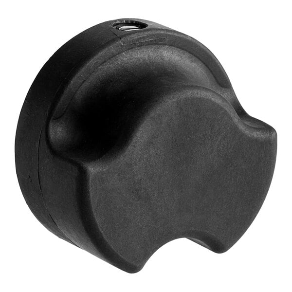 A black plastic Vulcan range knob with a hole in the center.