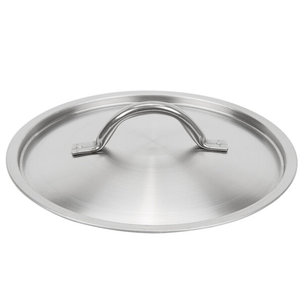 A close-up of a silver Vollrath stainless steel domed lid with a handle.