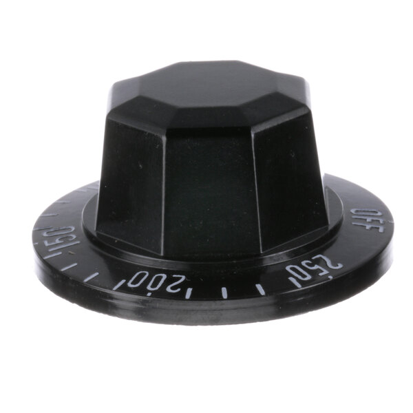 a black plastic object with a hexagon pattern