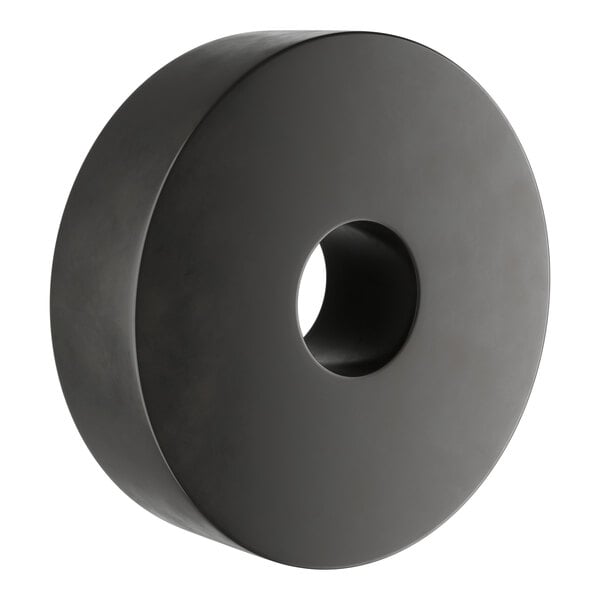 A black circular rubber donut with a hole in the middle.