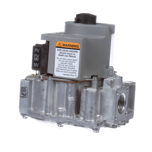 A grey metal Cleveland gas valve with a black label.