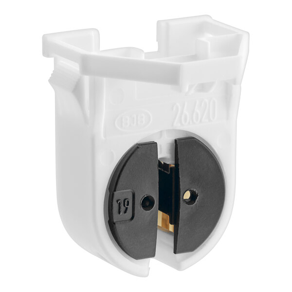A white BKI lamp holder with black electrical outlets.