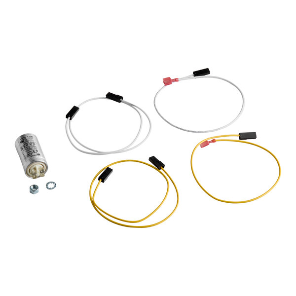 A set of electrical components including a cylindrical capacitor, two screws, and four wires with connectors, two white and two yellow.